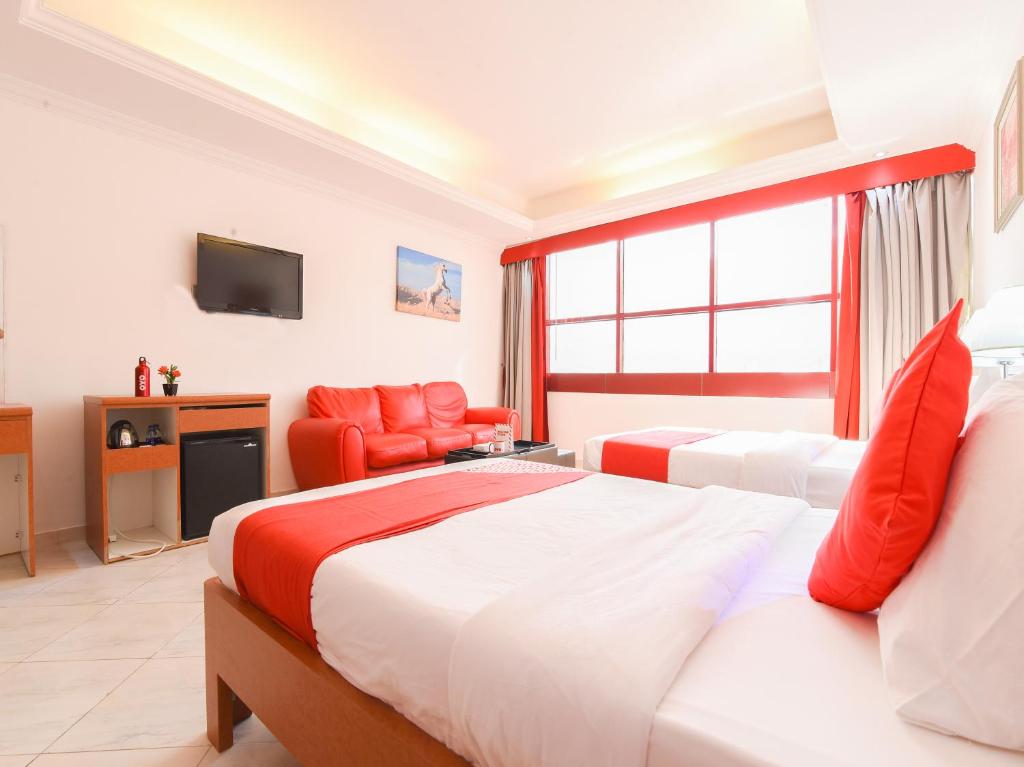 Postel nebo postele na pokoji v ubytování Mirage Hotel
