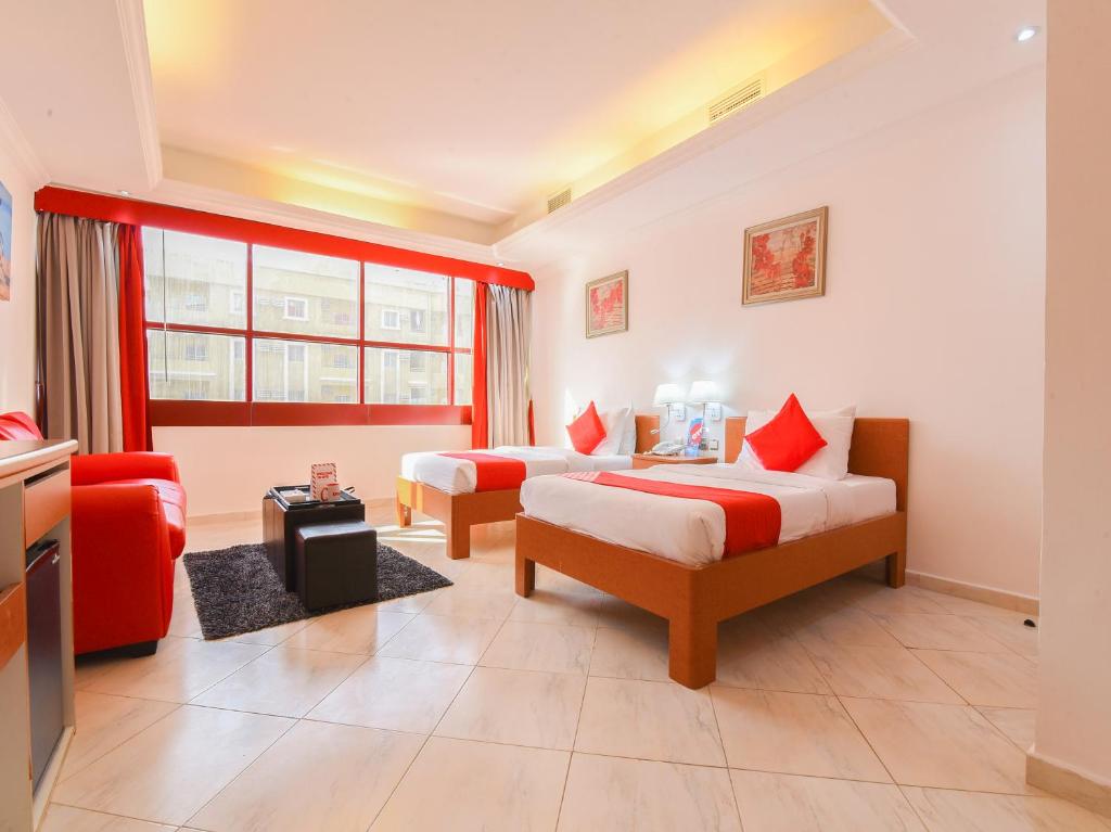 Postel nebo postele na pokoji v ubytování Mirage Hotel