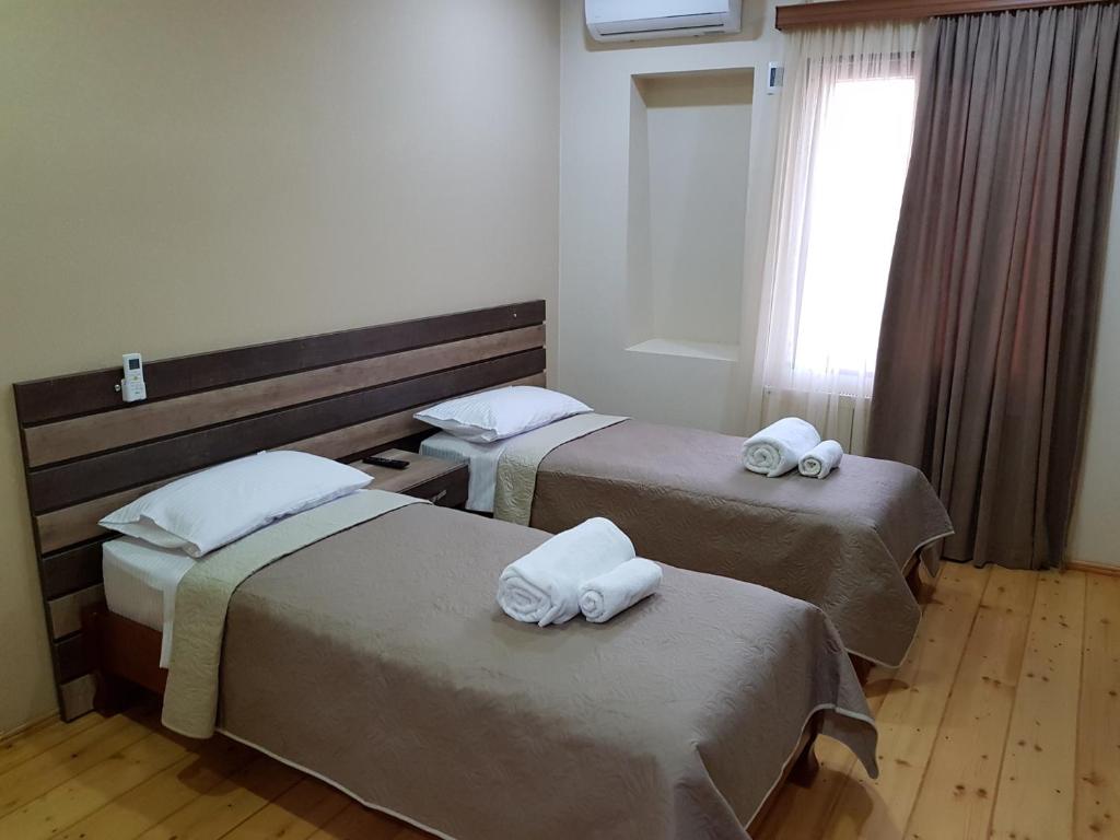 Postel nebo postele na pokoji v ubytování Hotel Villa