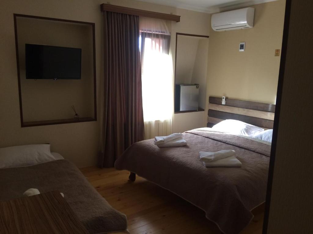 Postel nebo postele na pokoji v ubytování Hotel Villa