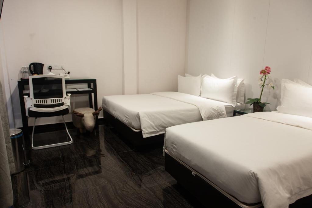 Postel nebo postele na pokoji v ubytování M Design Hotel @ Taman Pertama