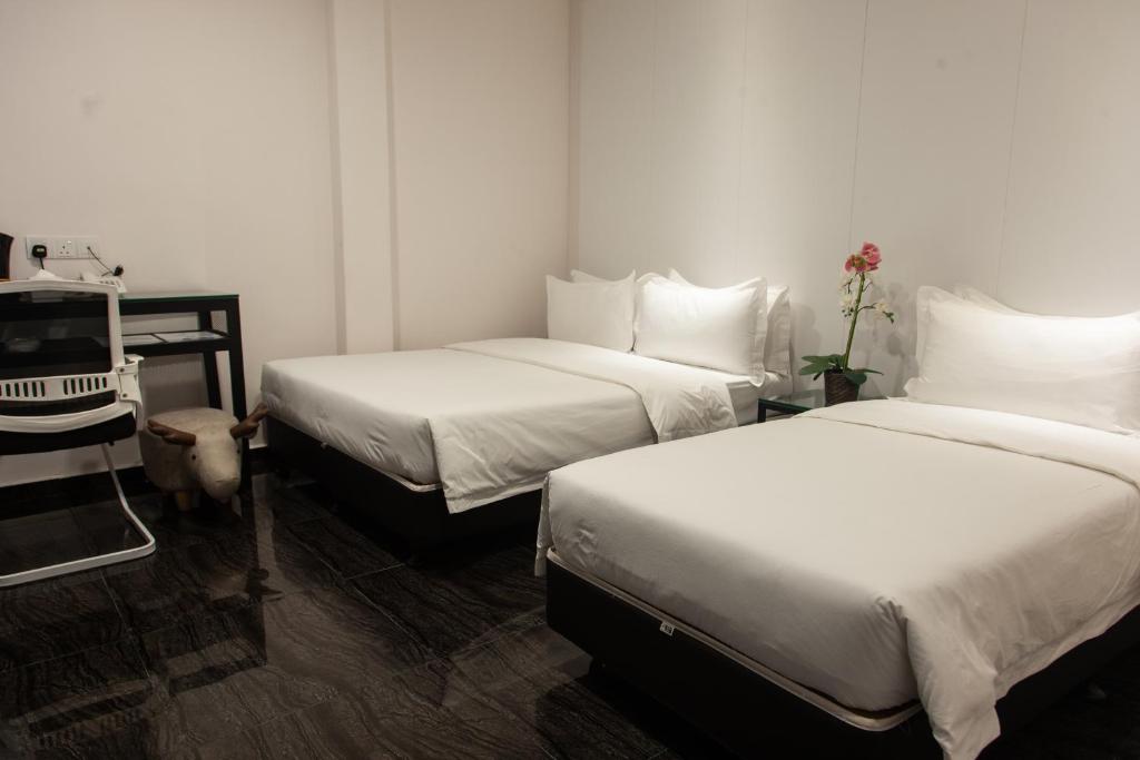 Postel nebo postele na pokoji v ubytování M Design Hotel @ Taman Pertama