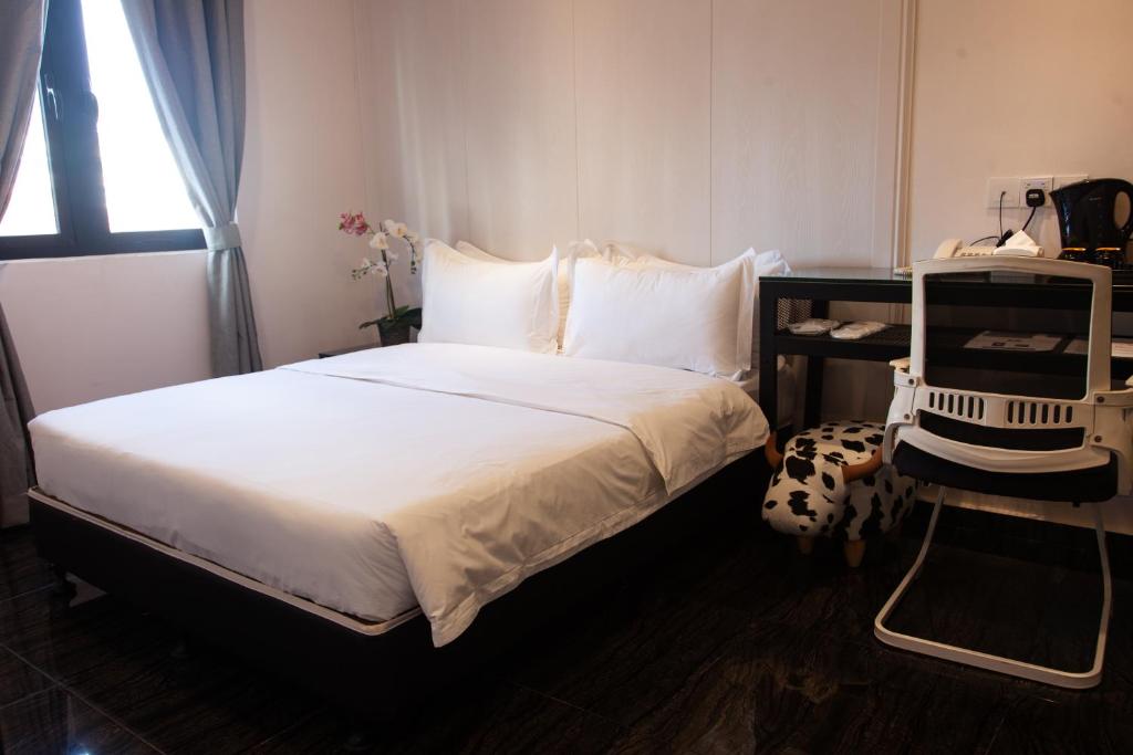 Postel nebo postele na pokoji v ubytování M Design Hotel @ Taman Pertama