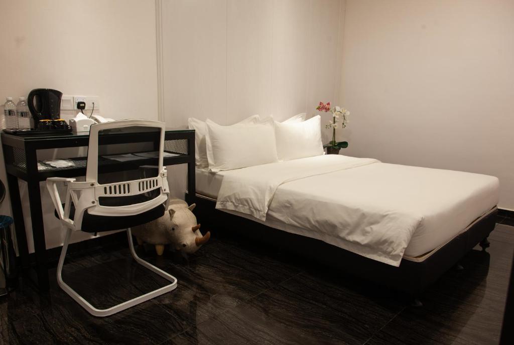 Postel nebo postele na pokoji v ubytování M Design Hotel @ Taman Pertama