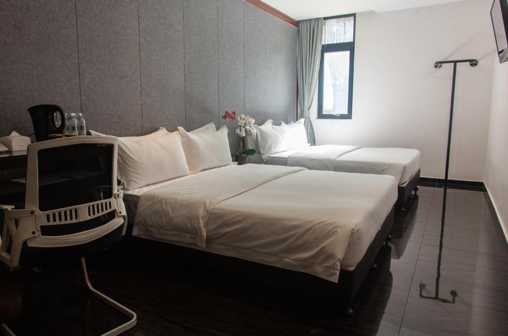 Postel nebo postele na pokoji v ubytování M Design Hotel @ Taman Pertama