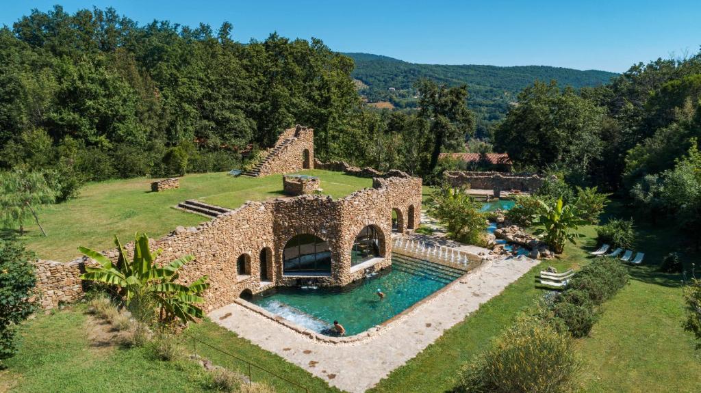 an aerial view of a house with a swimming pool at La Cerreta - Terme di Sassetta in Sassetta