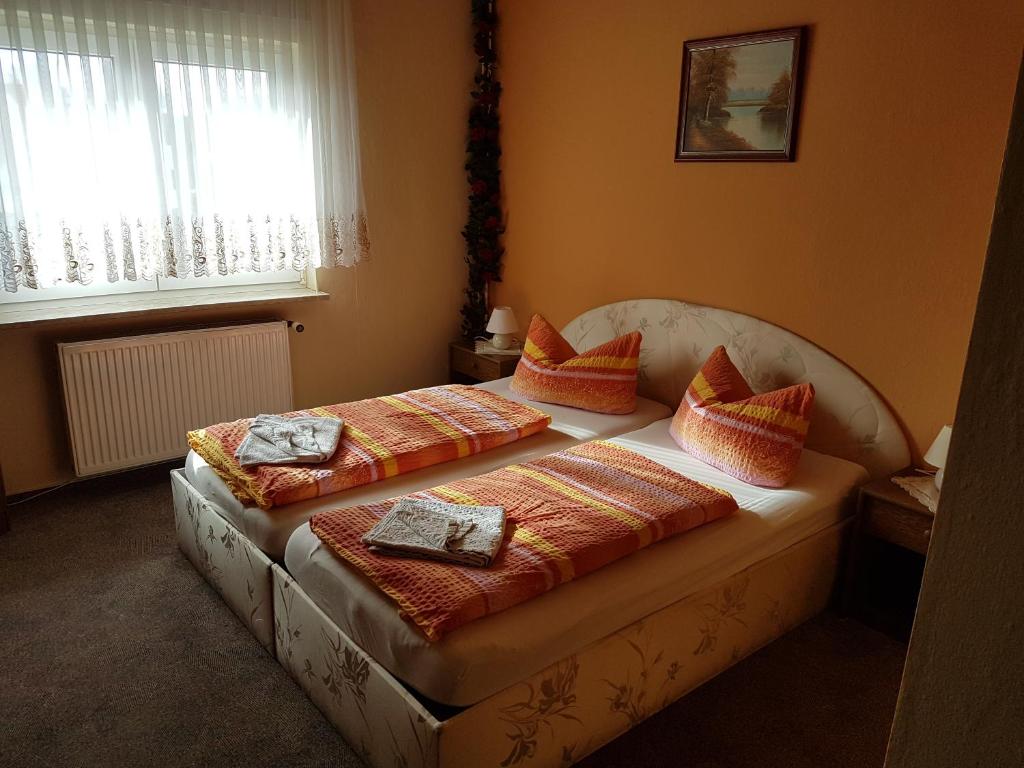 Postel nebo postele na pokoji v ubytování Hotel Arkona