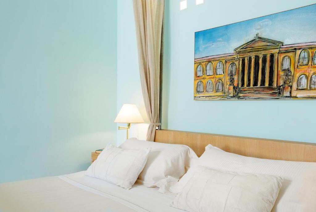Postel nebo postele na pokoji v ubytování Palazzo Brunaccini Boutique Hotel