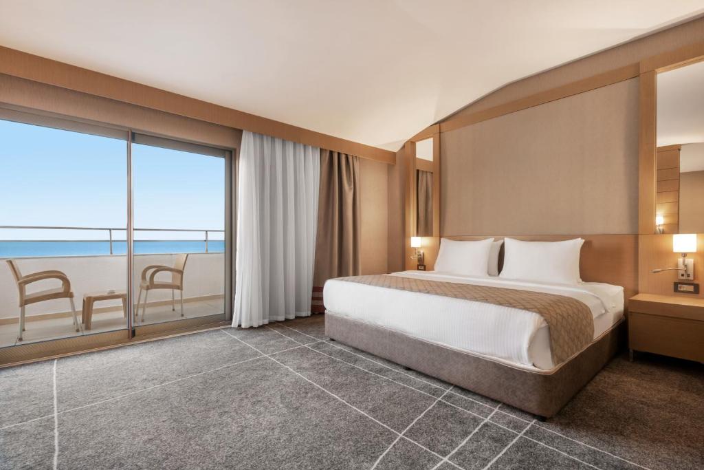A bed or beds in a room at Ramada Resort by Wyndham Unye