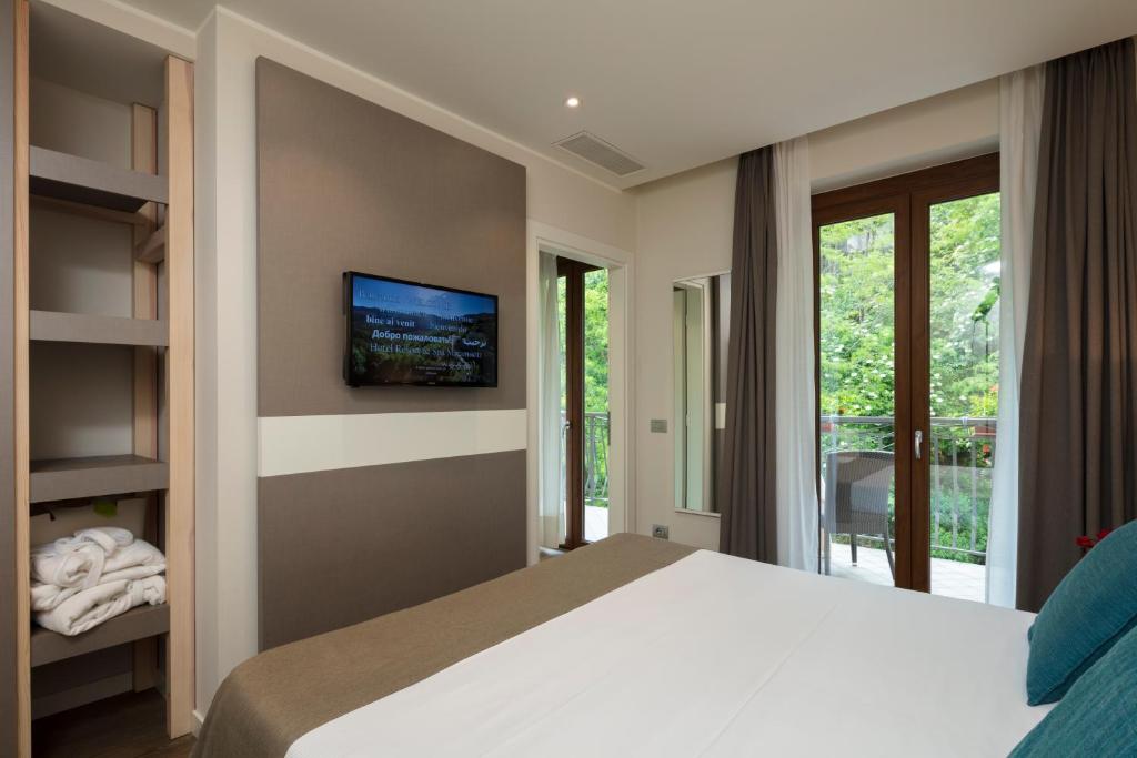 Postel nebo postele na pokoji v ubytování Hotel Resort & Spa Miramonti