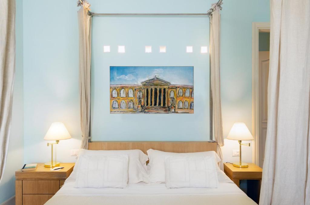Postel nebo postele na pokoji v ubytování Palazzo Brunaccini Boutique Hotel