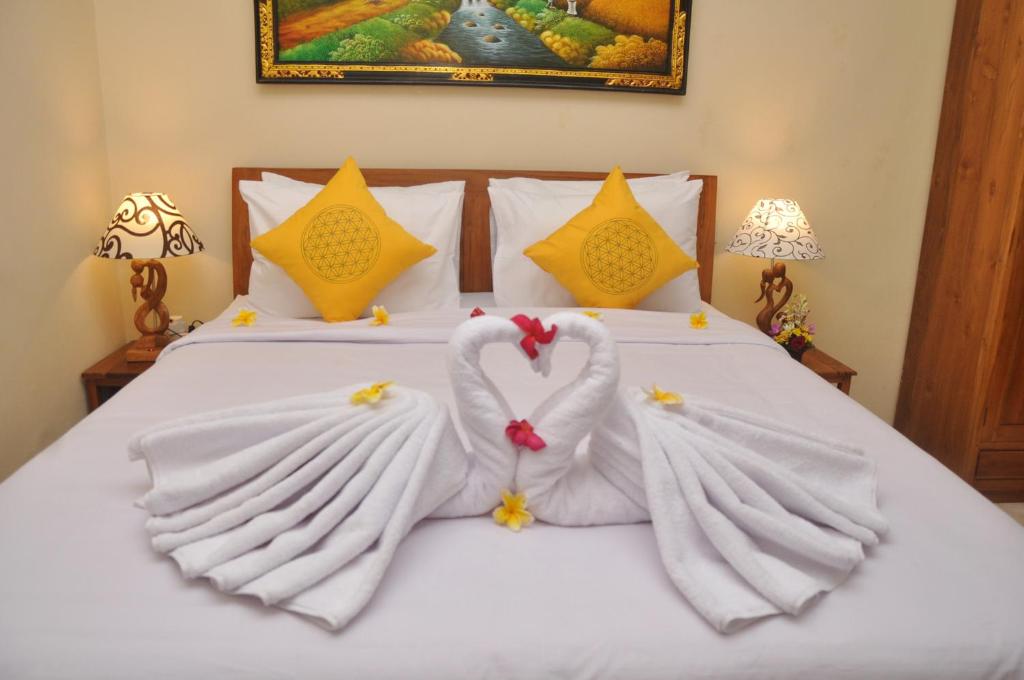 Postel nebo postele na pokoji v ubytování Dunung Sari Homestay