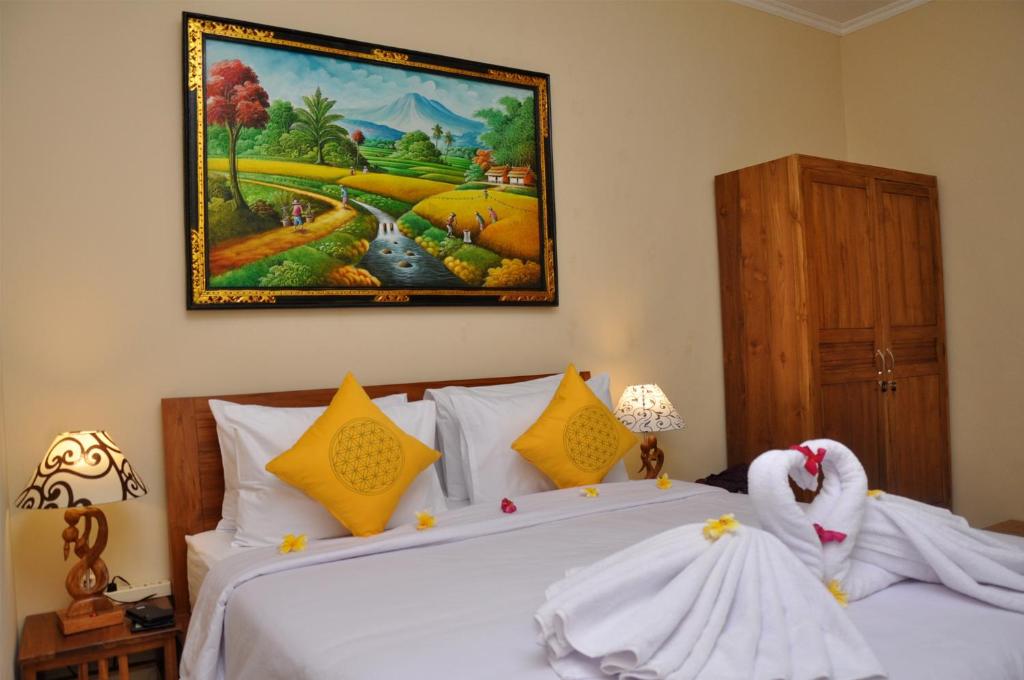 Postel nebo postele na pokoji v ubytování Dunung Sari Homestay