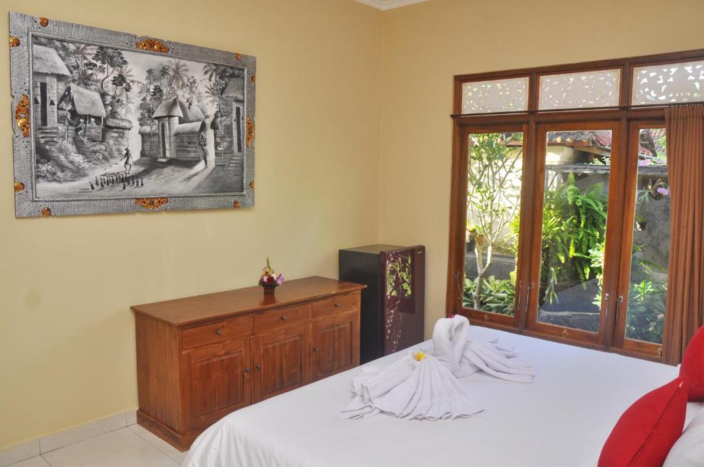Postel nebo postele na pokoji v ubytování Dunung Sari Homestay