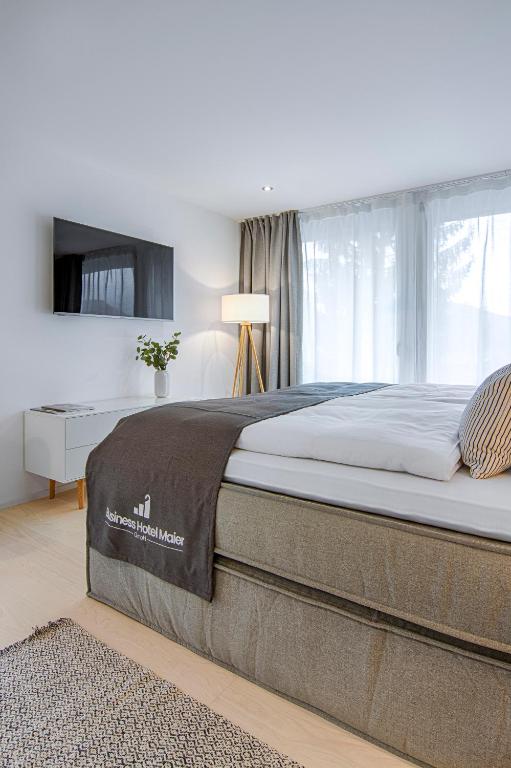Voodi või voodid majutusasutuse Business Hotel Maier toas