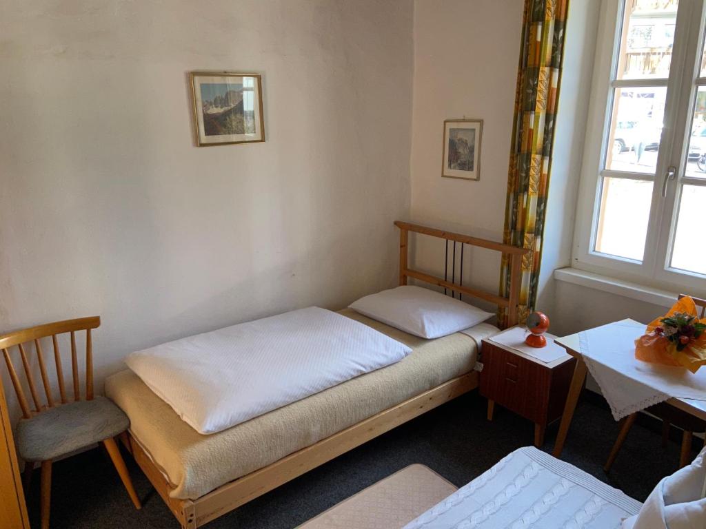 Postel nebo postele na pokoji v ubytování Gasthof Albergo Ressmair