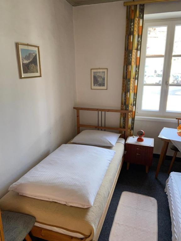 Postel nebo postele na pokoji v ubytování Gasthof Albergo Ressmair