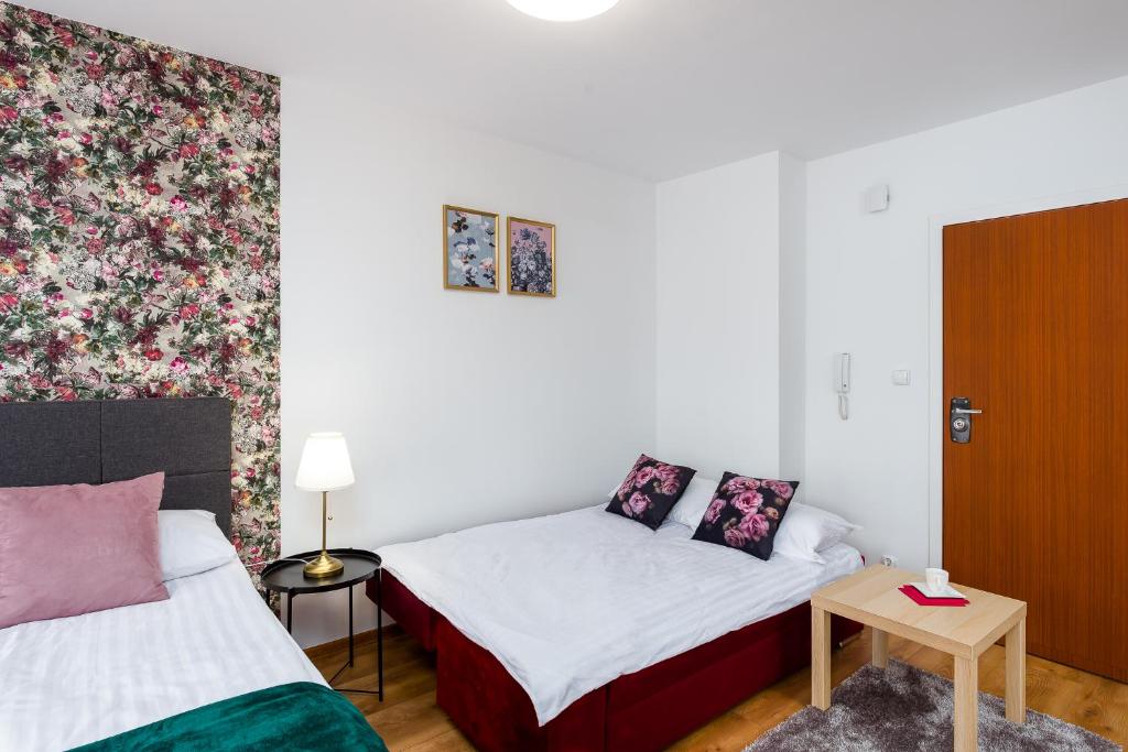 Posteľ alebo postele v izbe v ubytovaní Sleepway Apartments - English Dream