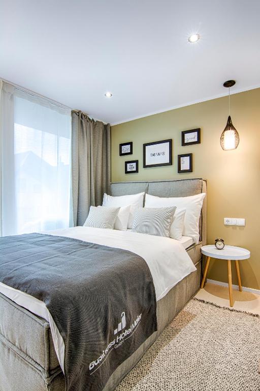 Voodi või voodid majutusasutuse Business Hotel Maier toas