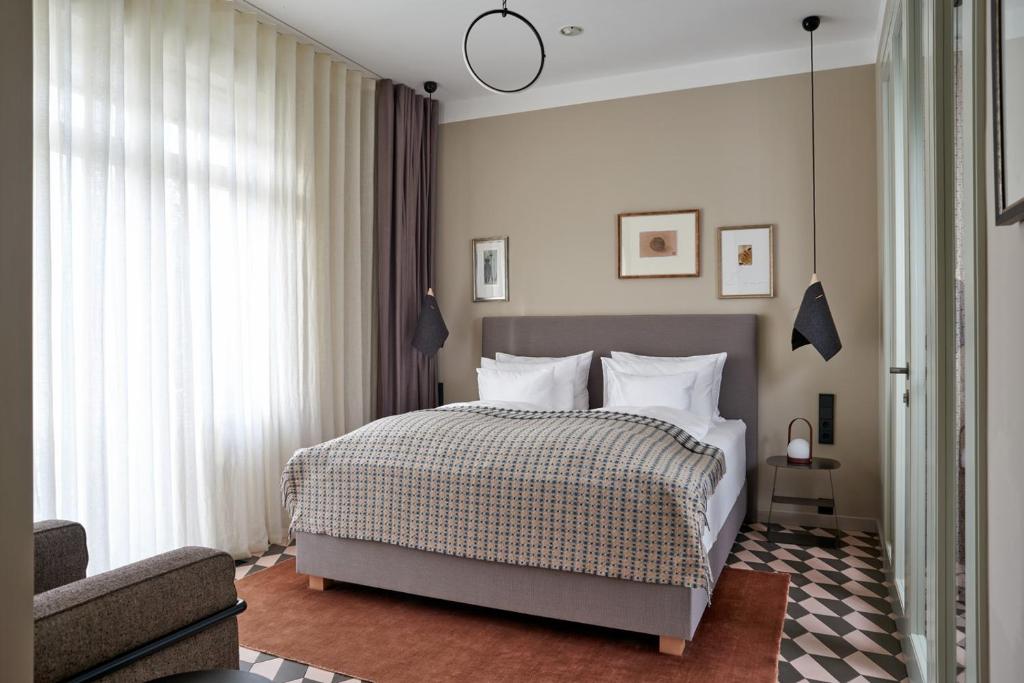 Postel nebo postele na pokoji v ubytování Bagatelle Gardenhouse