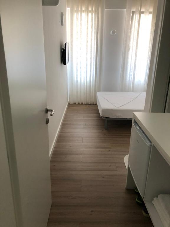 Postel nebo postele na pokoji v ubytování Aleksi rooms