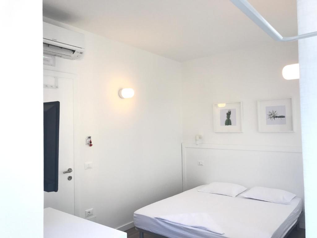 Postel nebo postele na pokoji v ubytování Aleksi rooms
