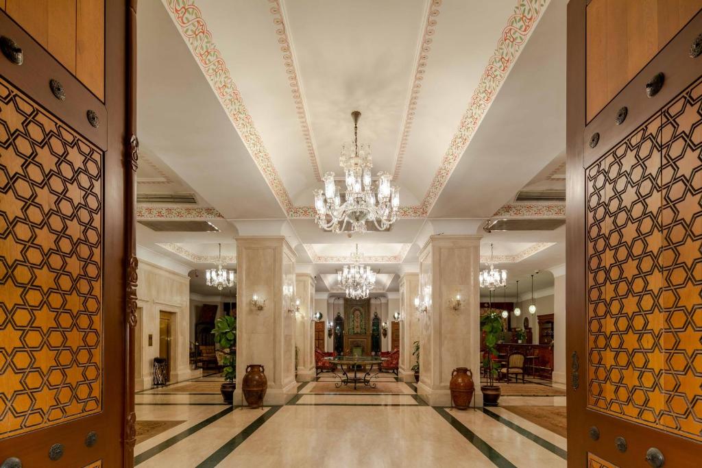 a large hallway with a chandelier in a building at Hotel Sultanhan - Special Category in Istanbul