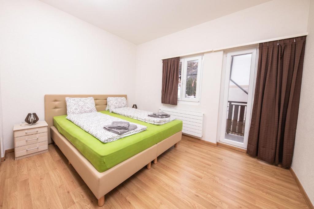Postel nebo postele na pokoji v ubytování Haus Astoria