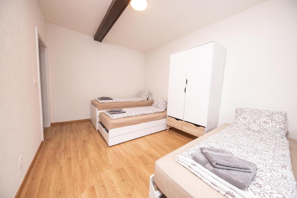 Postel nebo postele na pokoji v ubytování Haus Astoria