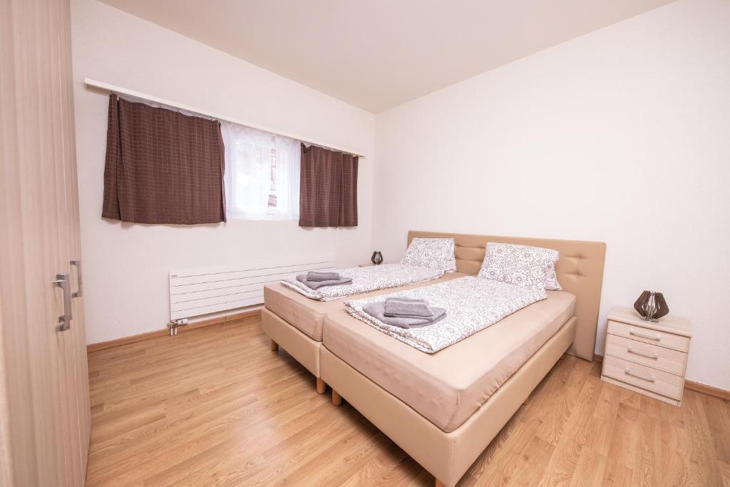 Postel nebo postele na pokoji v ubytování Haus Astoria