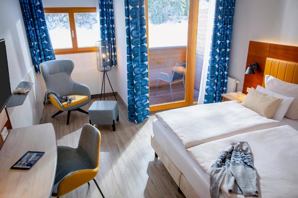 Postel nebo postele na pokoji v ubytování TUI BLUE Fieberbrunn