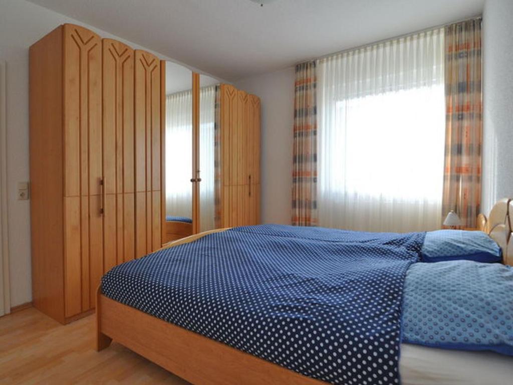 Postel nebo postele na pokoji v ubytování Ferienwohnung Duenenweg _ Haase