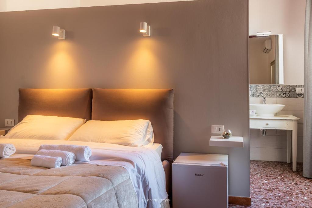 Postel nebo postele na pokoji v ubytování Bella Vista Rooms