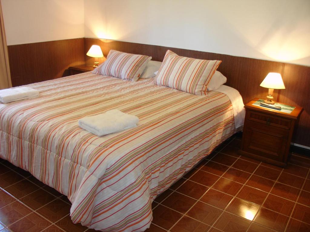 Postel nebo postele na pokoji v ubytování Hotel Victoria