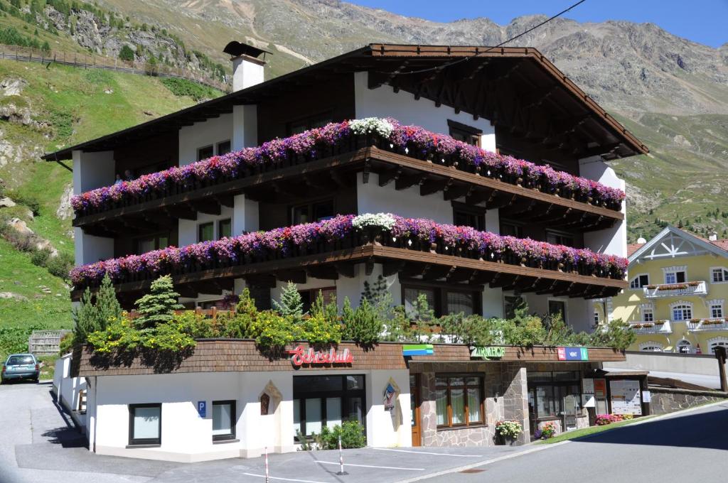 a building with flowers on the side of it at Appartements Zirmhof in Vent