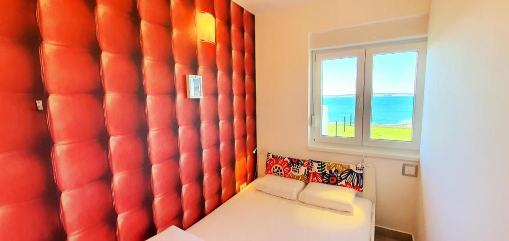 Postel nebo postele na pokoji v ubytování Apartments Nicolas - Beach & Sea 10m away - Amazing sea view!