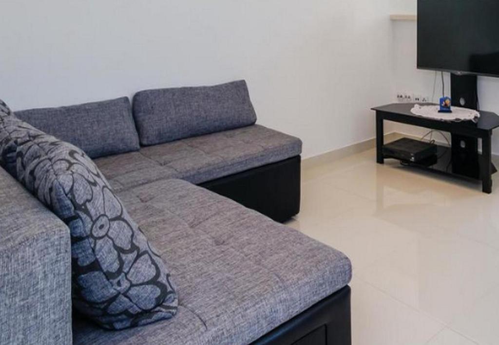 Televízia a/alebo spoločenská miestnosť v ubytovaní Holiday Home Mediterranean Dream