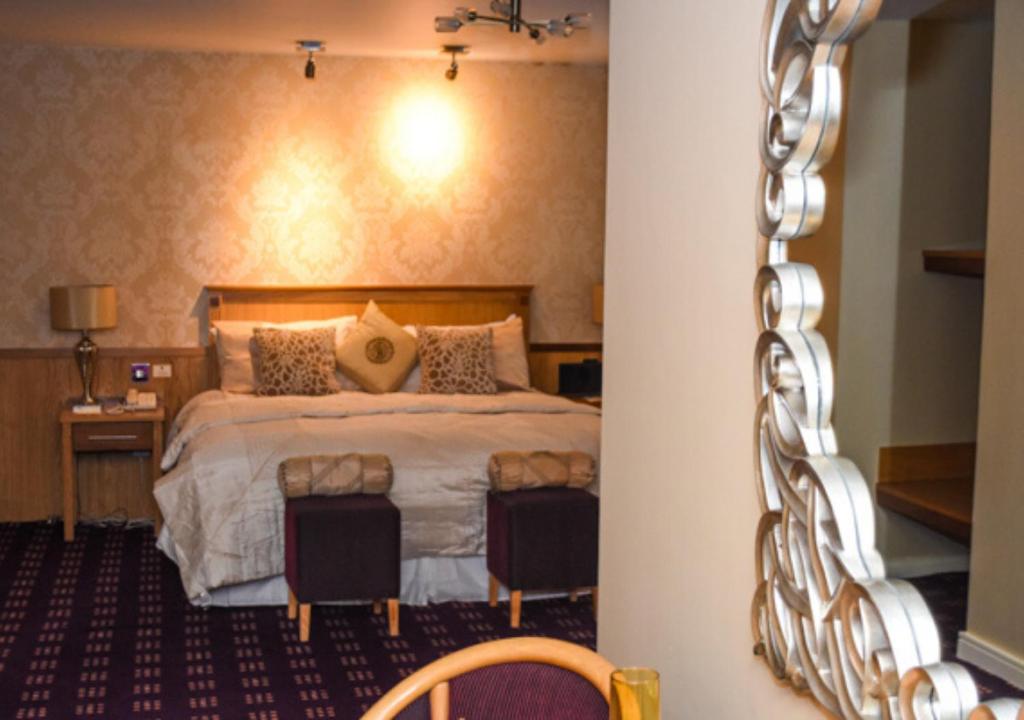 Postel nebo postele na pokoji v ubytování Bush Hotel