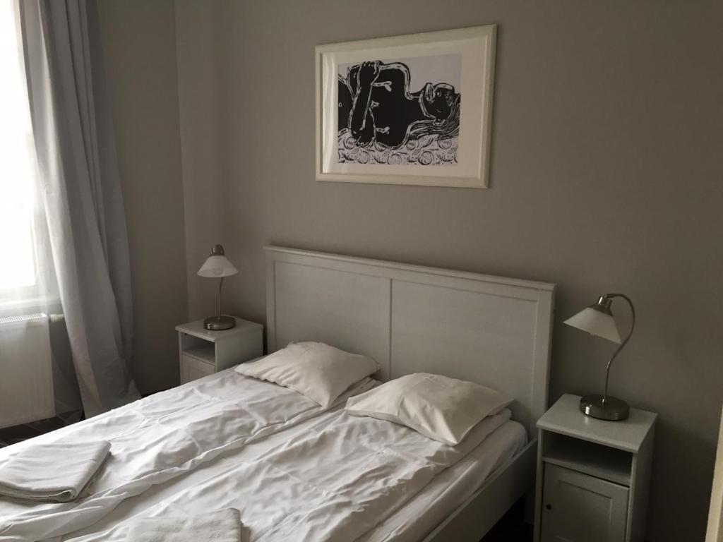 Posteľ alebo postele v izbe v ubytovaní Floriańska Grand Apartment 2