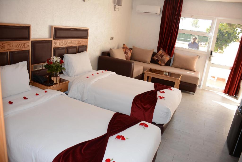 Postel nebo postele na pokoji v ubytování Hotel Club Almoggar Garden Beach