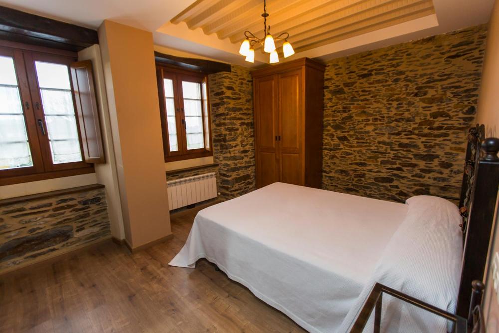 Postel nebo postele na pokoji v ubytování Apartamentos Casa Mateo