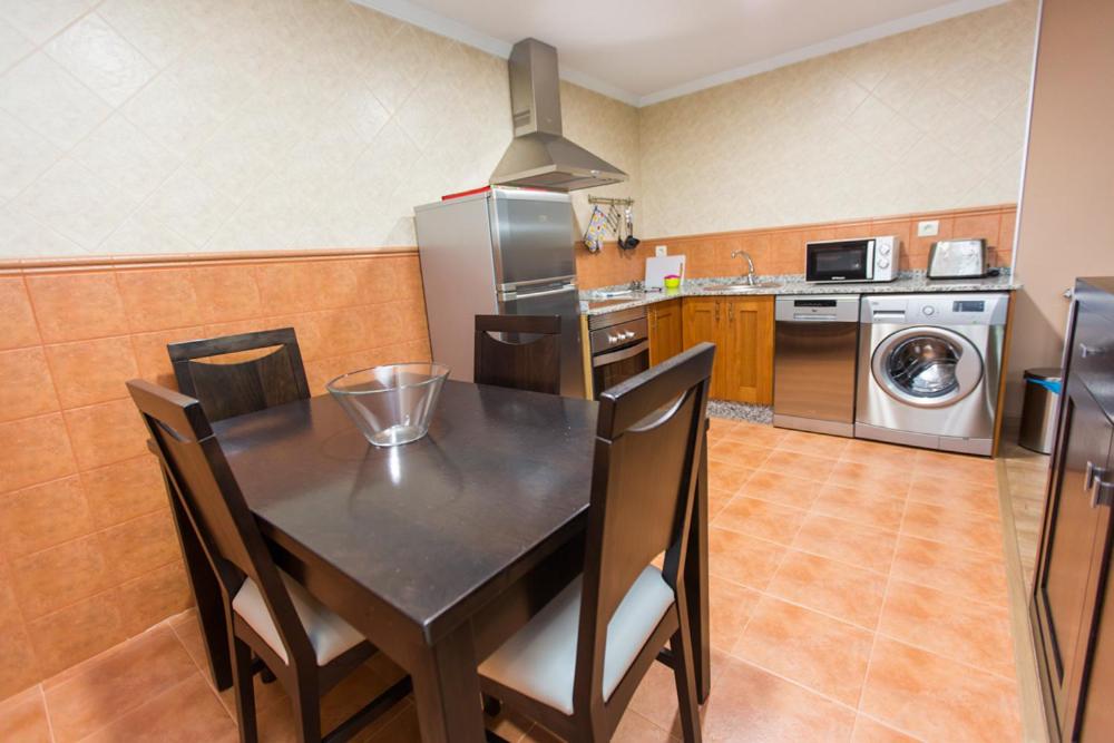 Kuchyň nebo kuchyňský kout v ubytování Apartamentos Casa Mateo