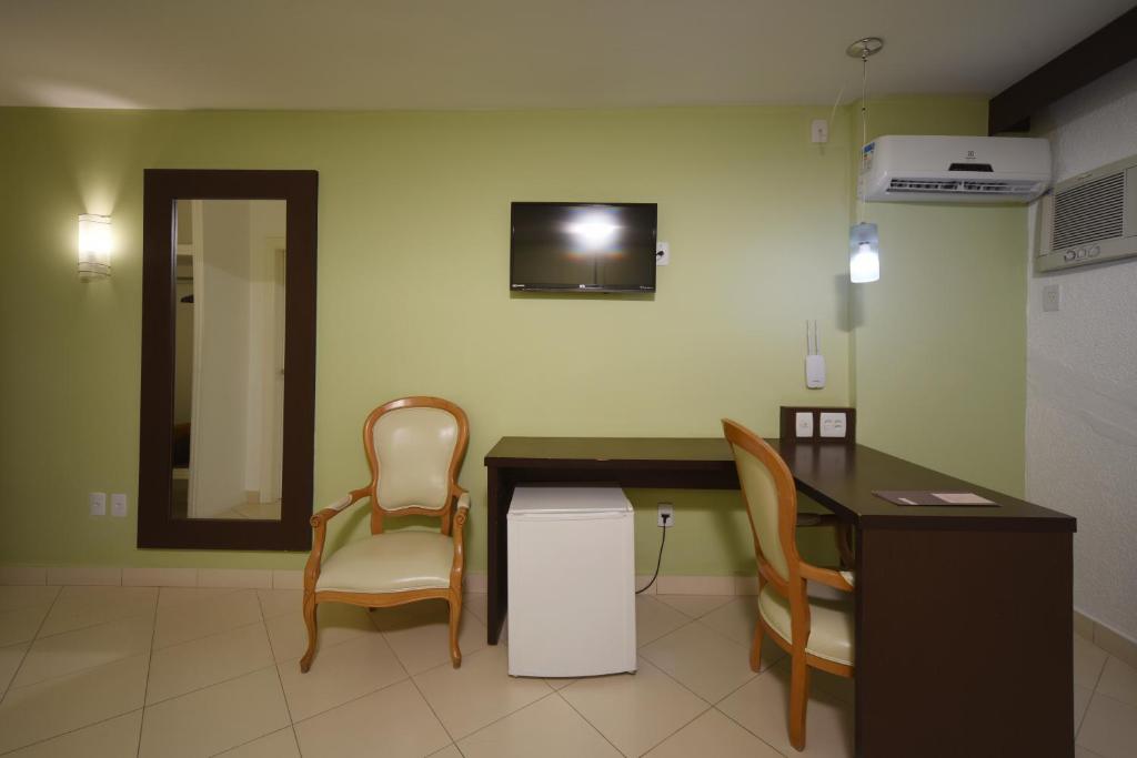 TV a/nebo společenská místnost v ubytování Hotel Dunamys Curitiba