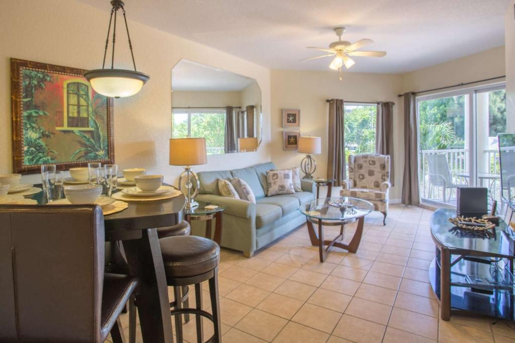 a living room with a couch and a table at 202-S - Sunset Vistas in St. Pete Beach