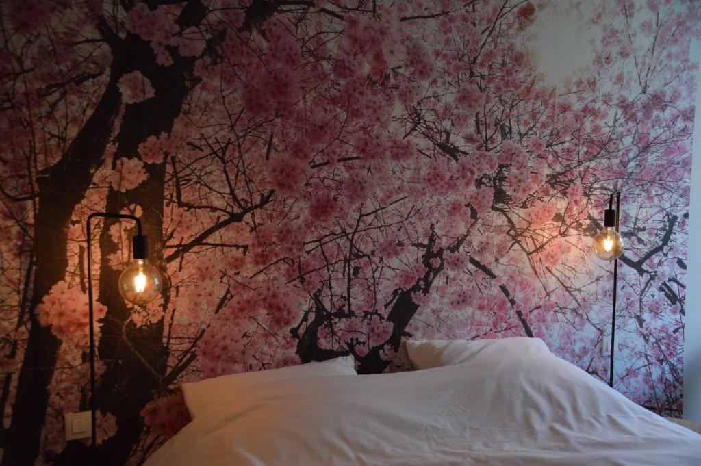 Postel nebo postele na pokoji v ubytování B&B Tantine