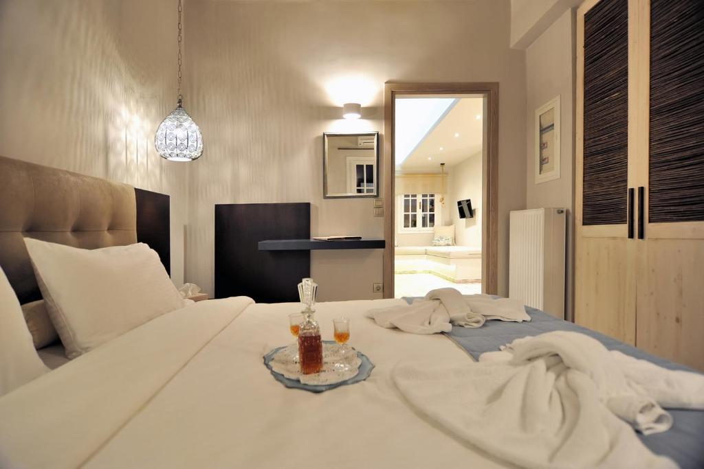 Posteľ alebo postele v izbe v ubytovaní Ganimede Hotel, Galaxidi