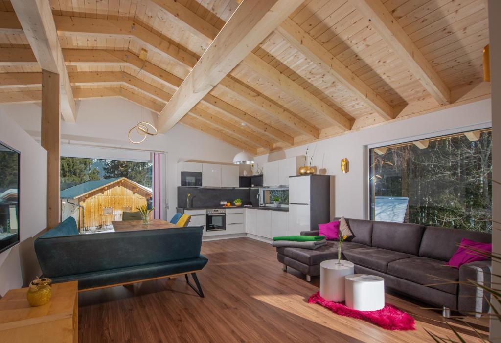 a living room with a couch and a table at Appartement Ahorn in Ramsau am Dachstein