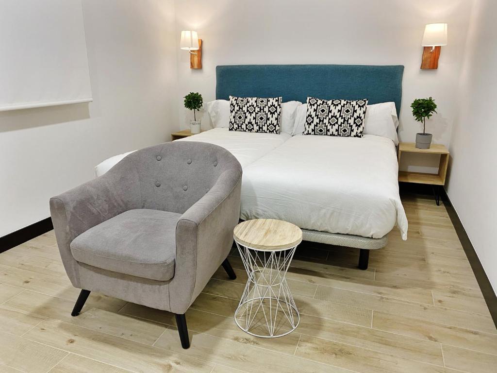 A bed or beds in a room at La SIGRINA Tuy