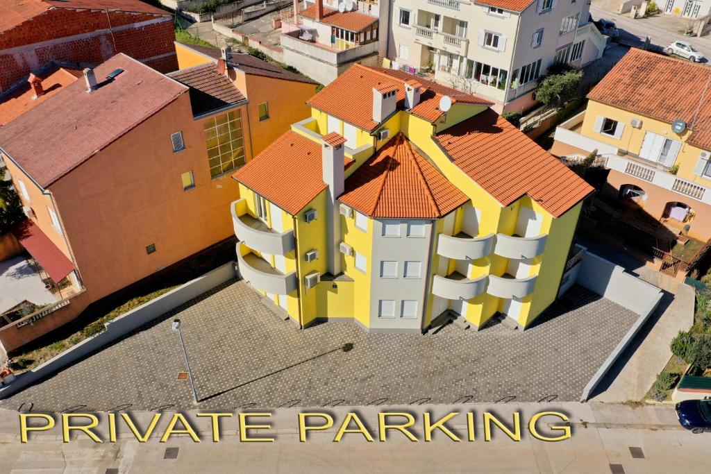 an overhead view of a building with the words private parking at Apartments Bosankic in Pula
