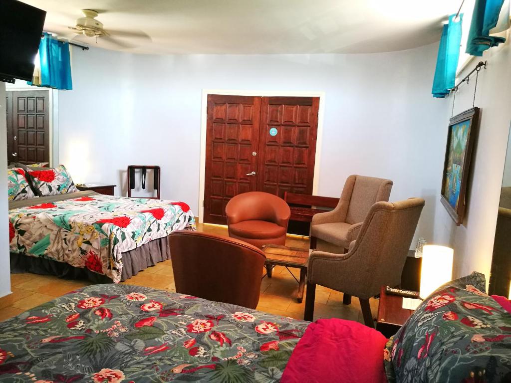 Postel nebo postele na pokoji v ubytování Hotel Casa 69